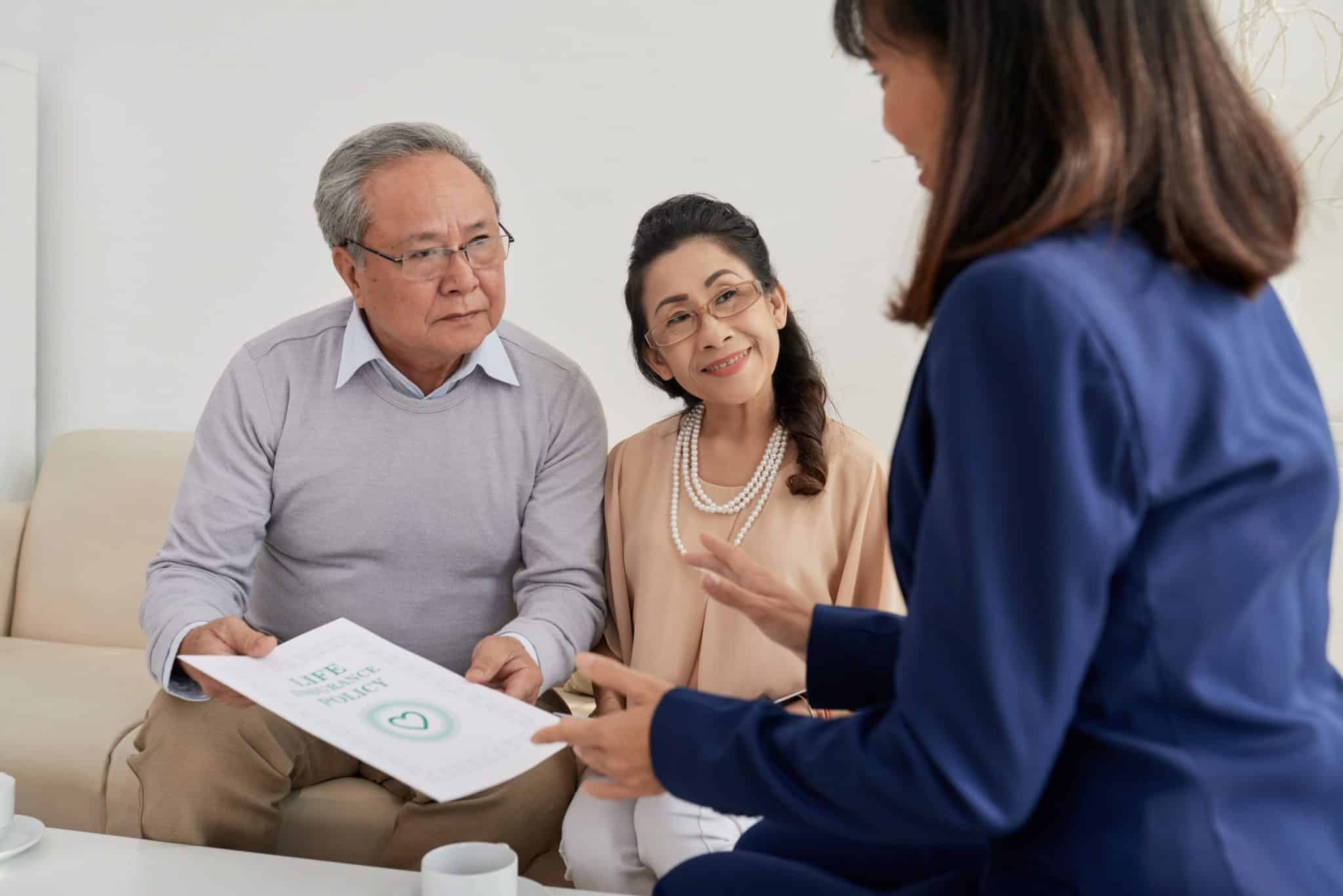 Asian Family Discussing International Health Insurance